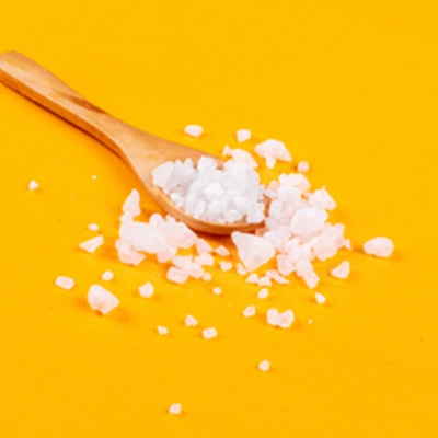 Salt crystals on a wooden spoon (illustration, not a photo of the ElectroSlim powder)