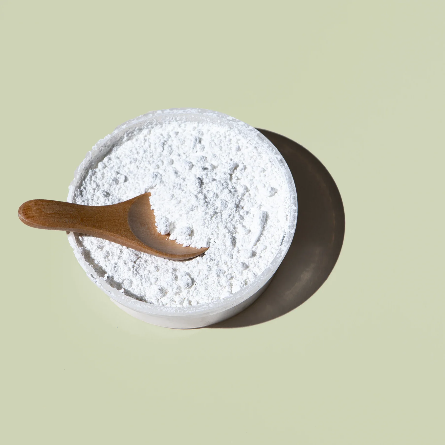 A bowl of white supplement powder